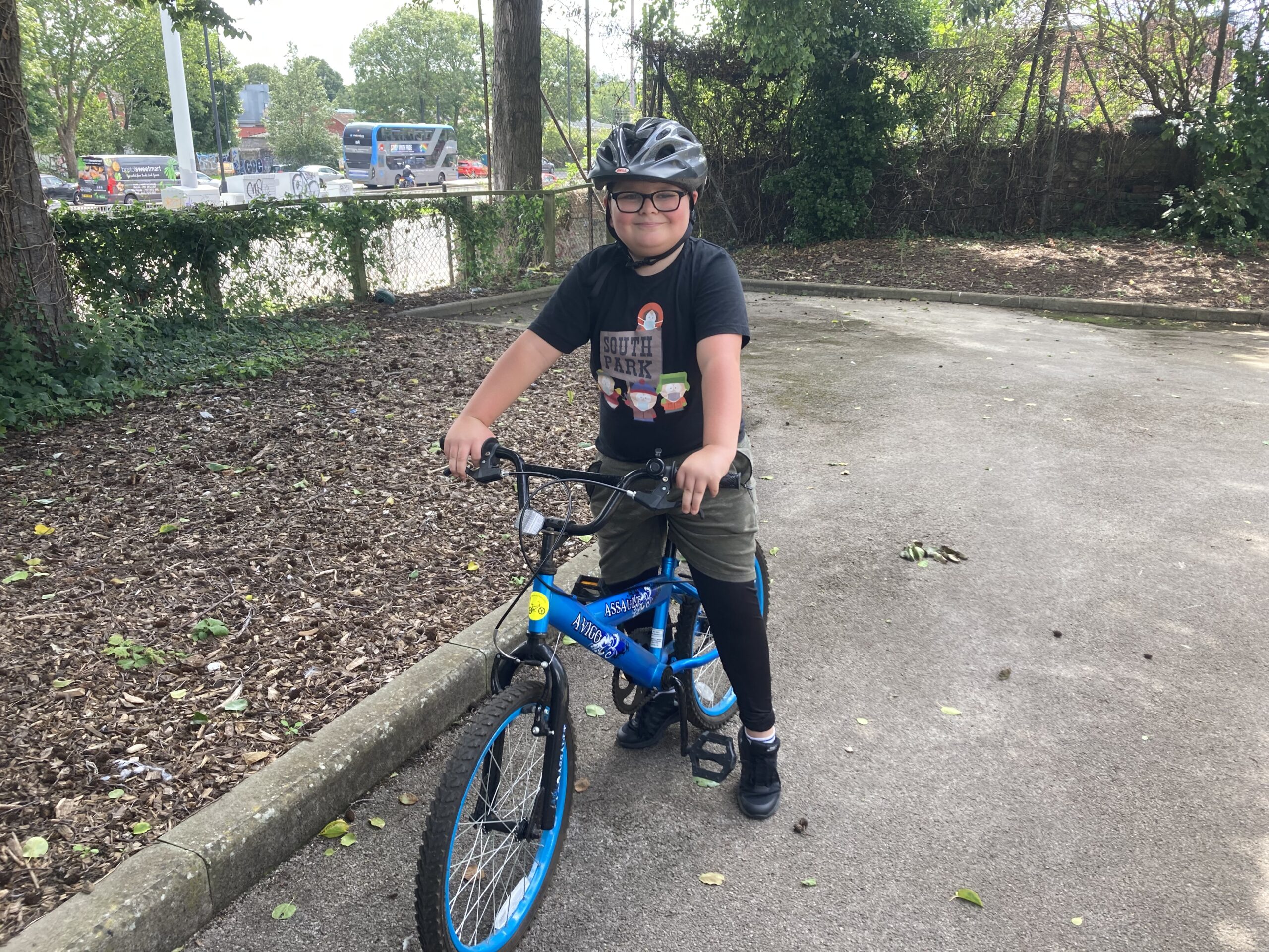A child learning to ride at bike club.