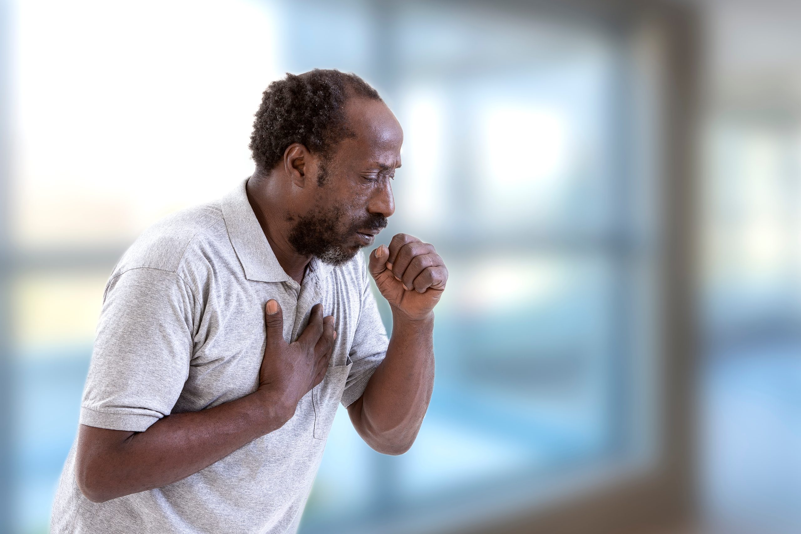 Man coughing.