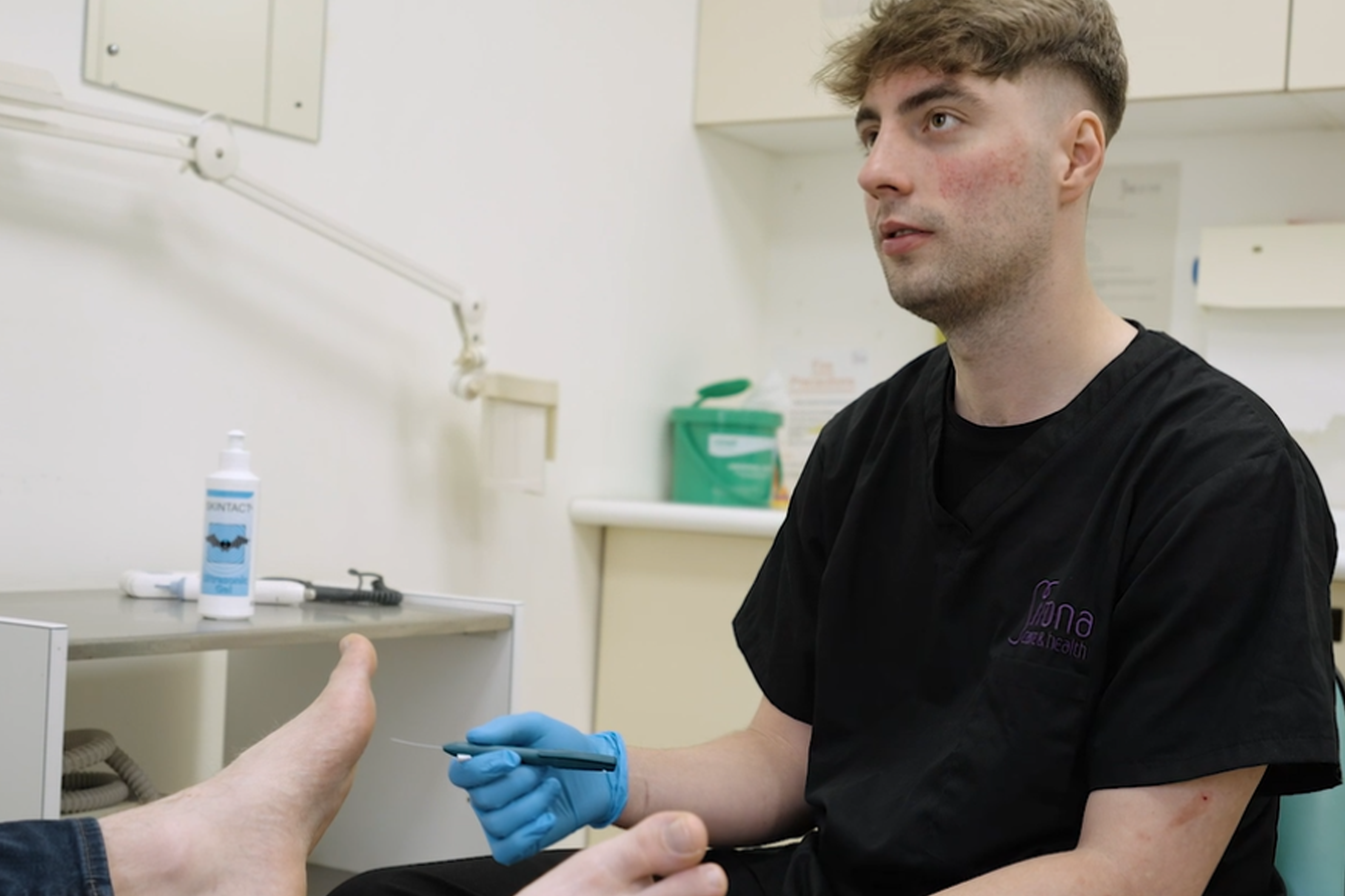 Podiatrist treating feet.