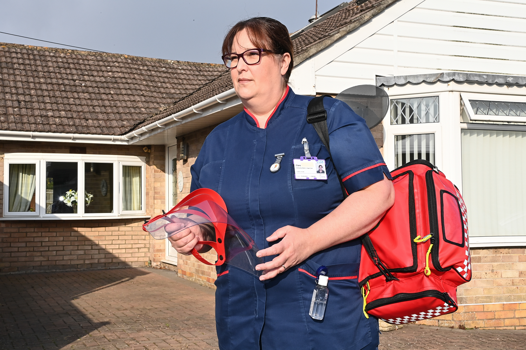Staff member visiting someone in their home.
