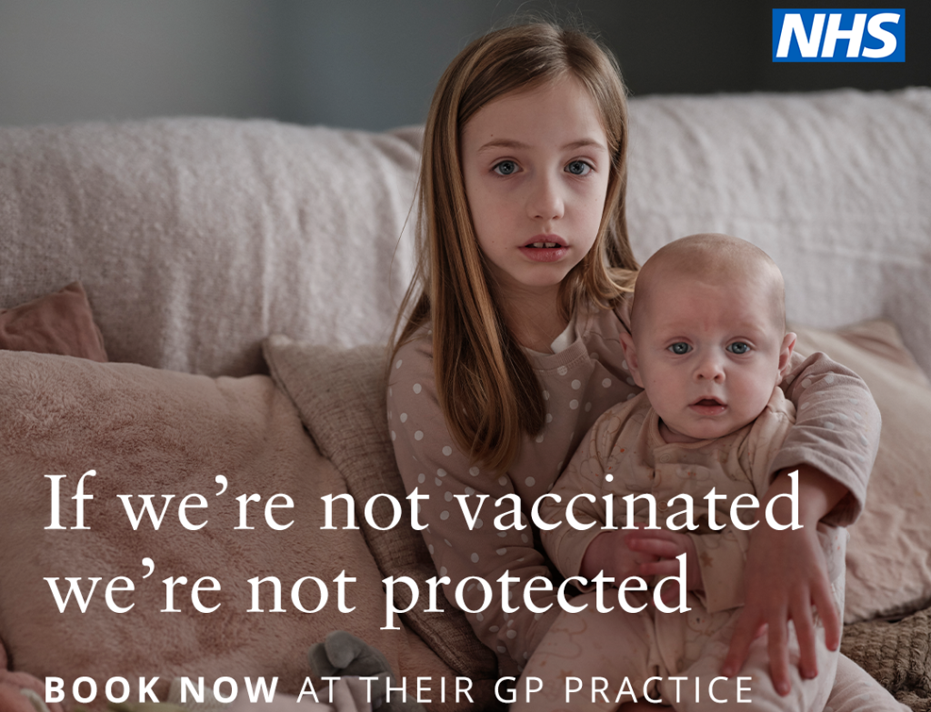 Young girl and baby sitting on sofa with message: "If we're not vaccinated, we're not protected."