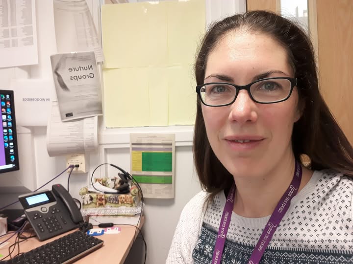 Dr Tamsin Woodbridge sitting at her computer.