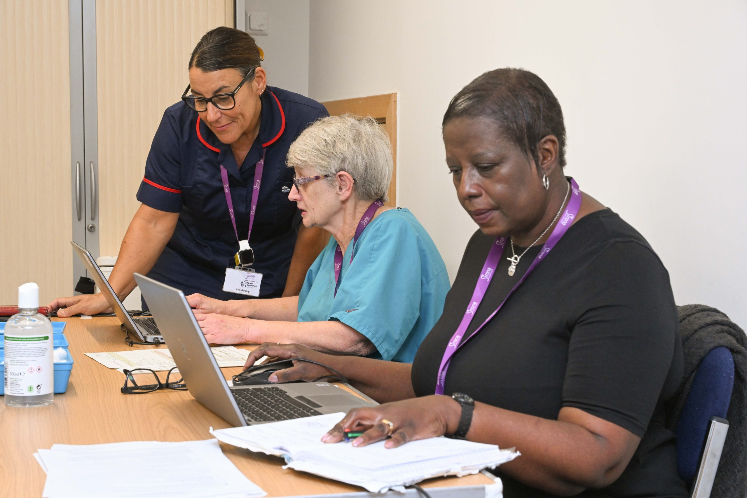 Clinical staff at a desk