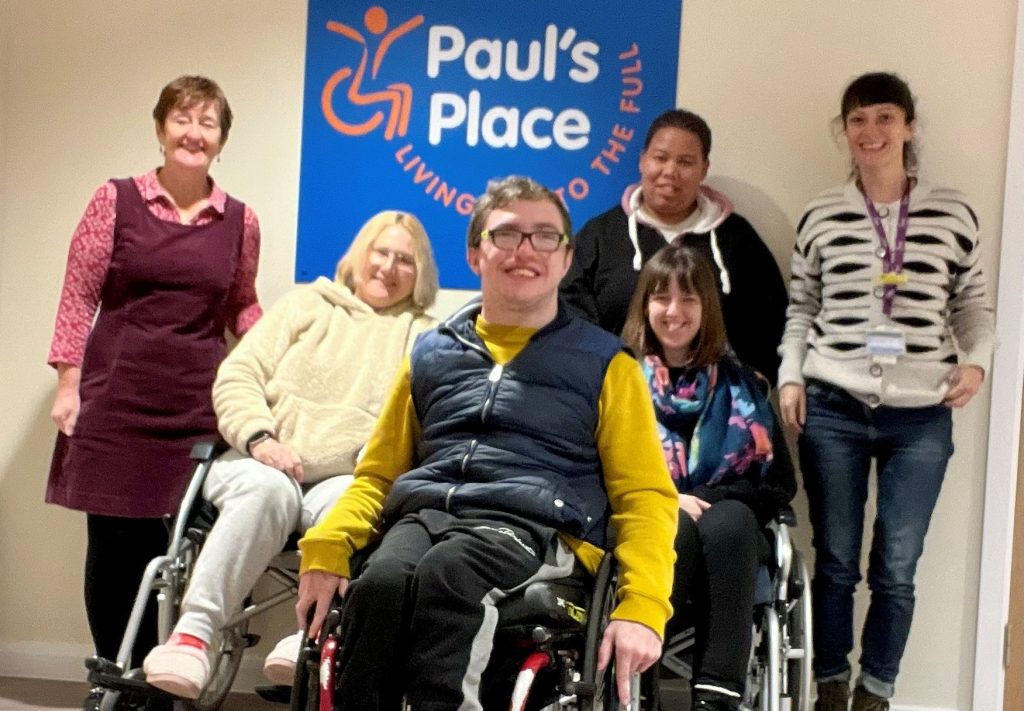 Suzannah Cook with members of Paul's Place.